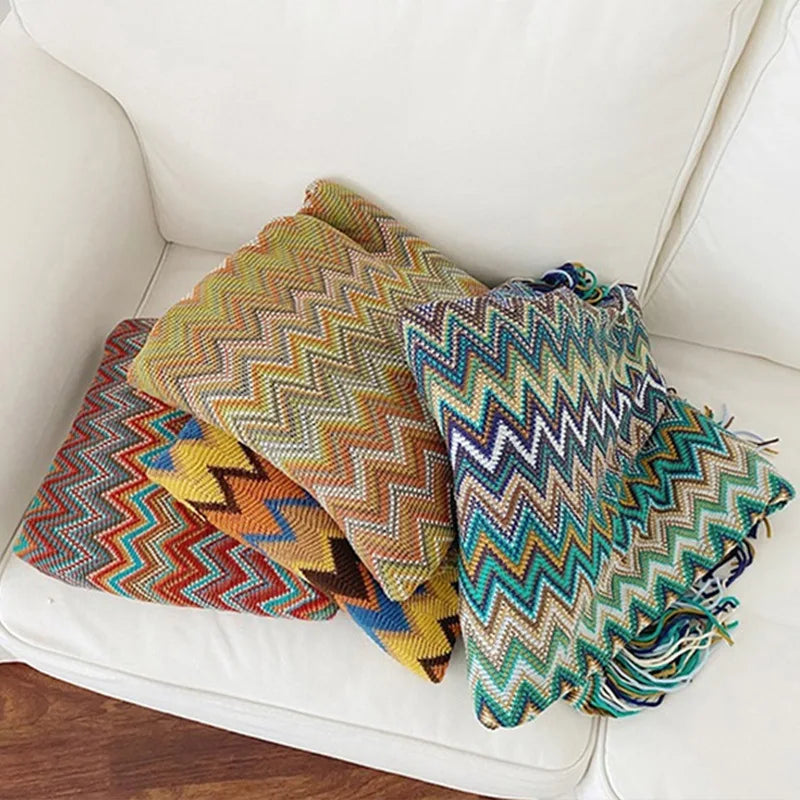 Jeté bohème en tricot à motif géométrique avec pompons