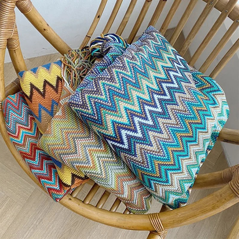 Jeté bohème en tricot à motif géométrique avec pompons