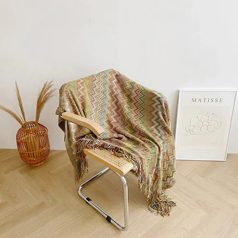 Jeté bohème en tricot à motif géométrique avec pompons