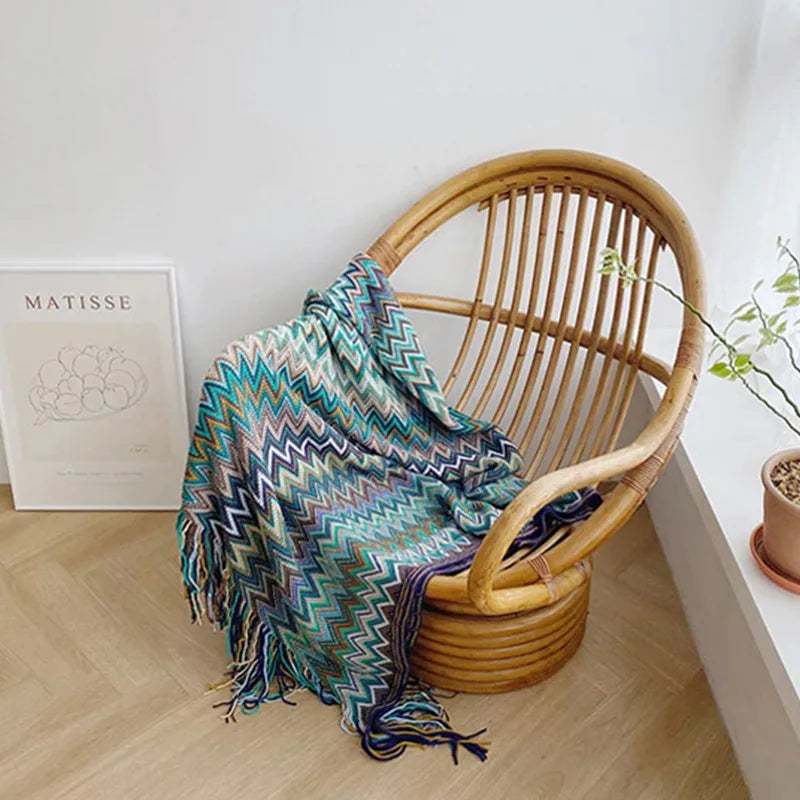Jeté bohème en tricot à motif géométrique avec pompons