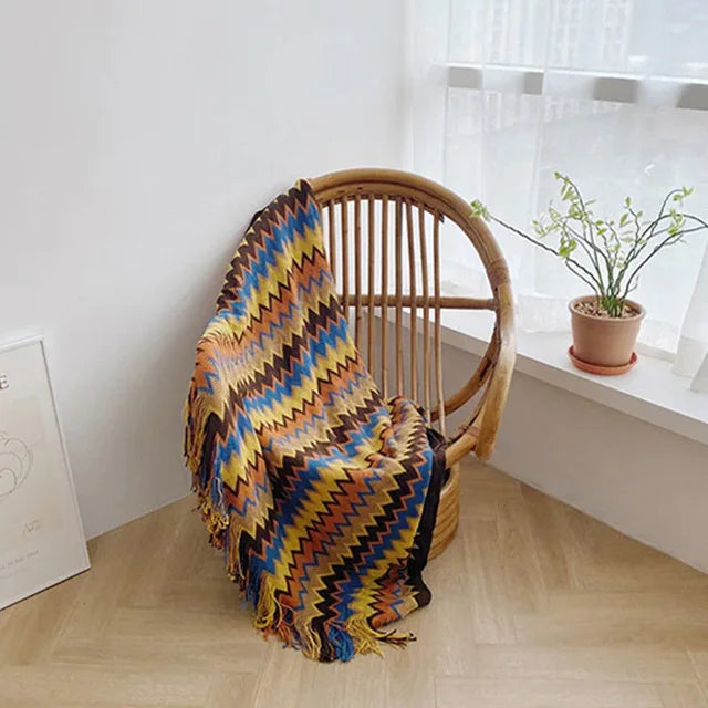 Jeté bohème en tricot à motif géométrique avec pompons