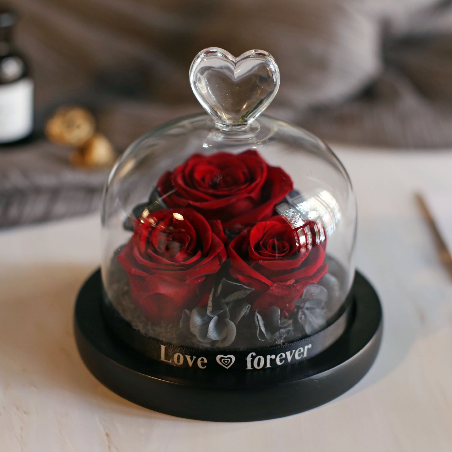 Immortal roses under glass dome.